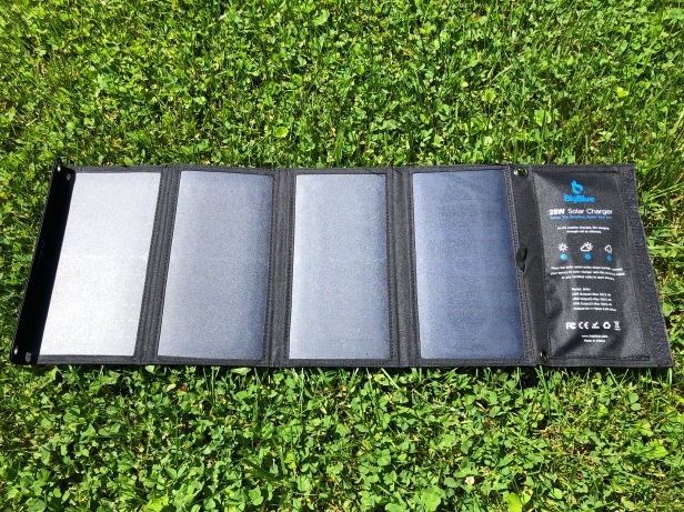 BigBlue 28W solar charger in the grass