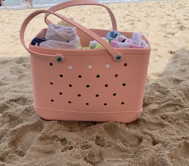 Bogg Bag on the sand with towels