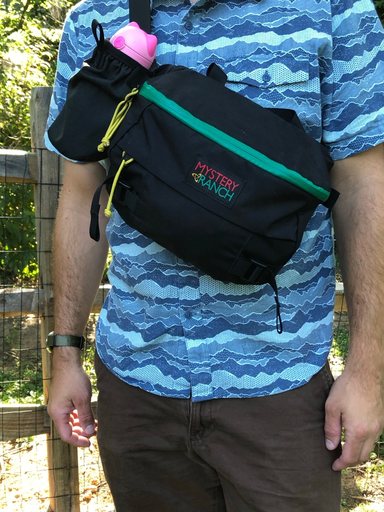 The Mystery Ranch Hip Monkey pack worn as a cross-body bag